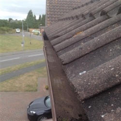 Gutter filled with moss after cleaning, Kesgrave, Ipswich, Suffolk